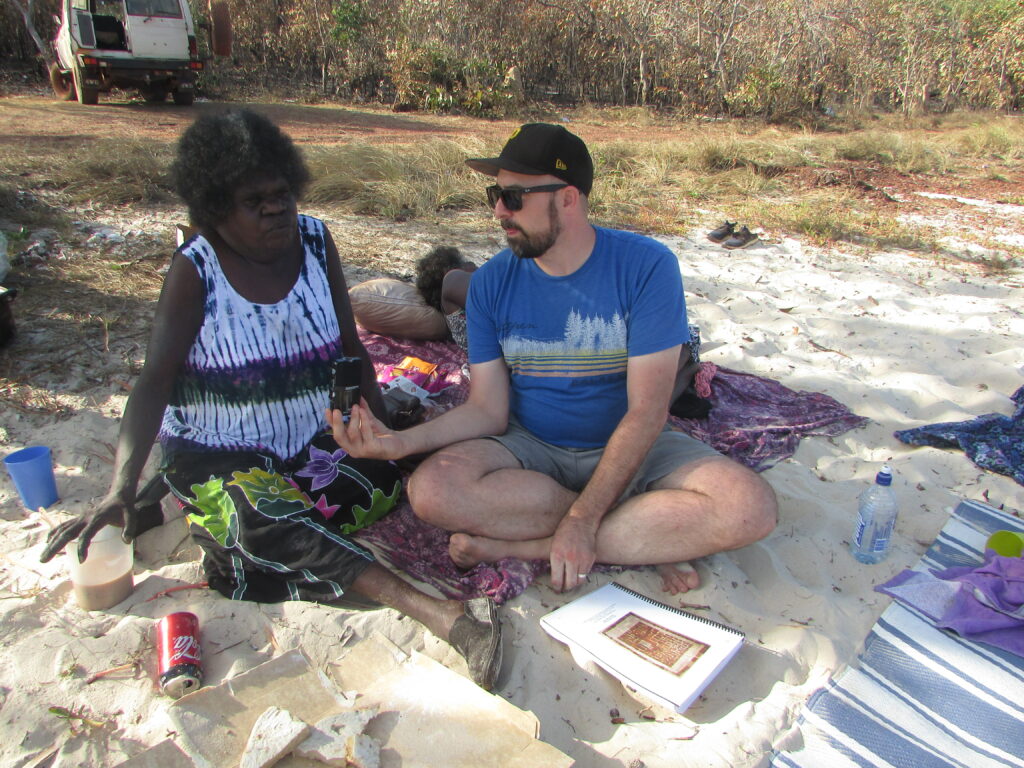 Marrnyula Munuŋgurr being interviewed by Henry Skerritt for MAḎADYIN: Eight Decades of Aboriginal Australian Bark Painting from Yirrkala. Photo by Maia Nuku.